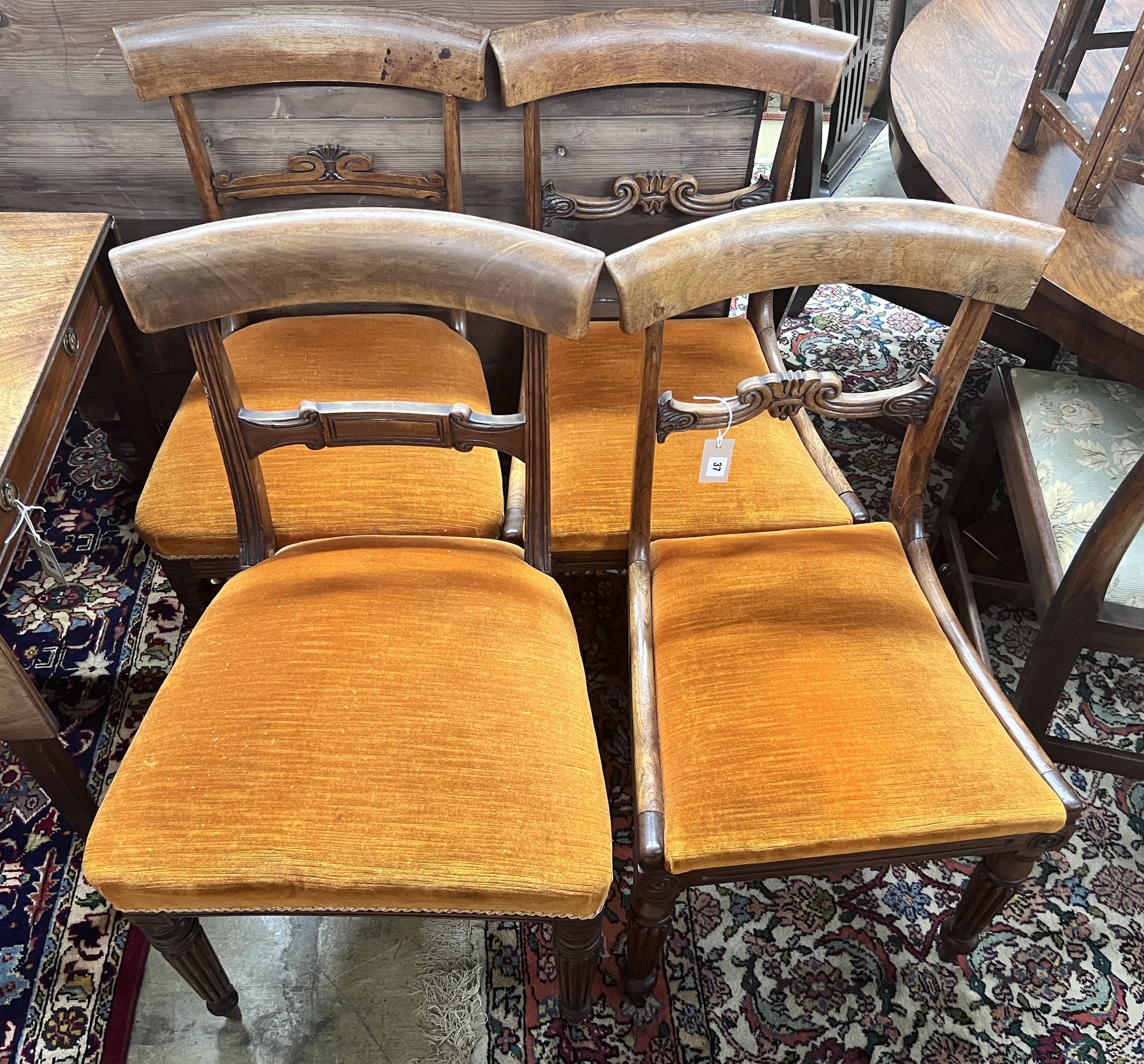 A harlequin set of four Regency dining chairs